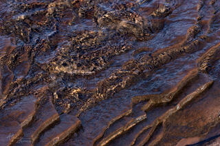 water ripples and wet rock at lake edge
