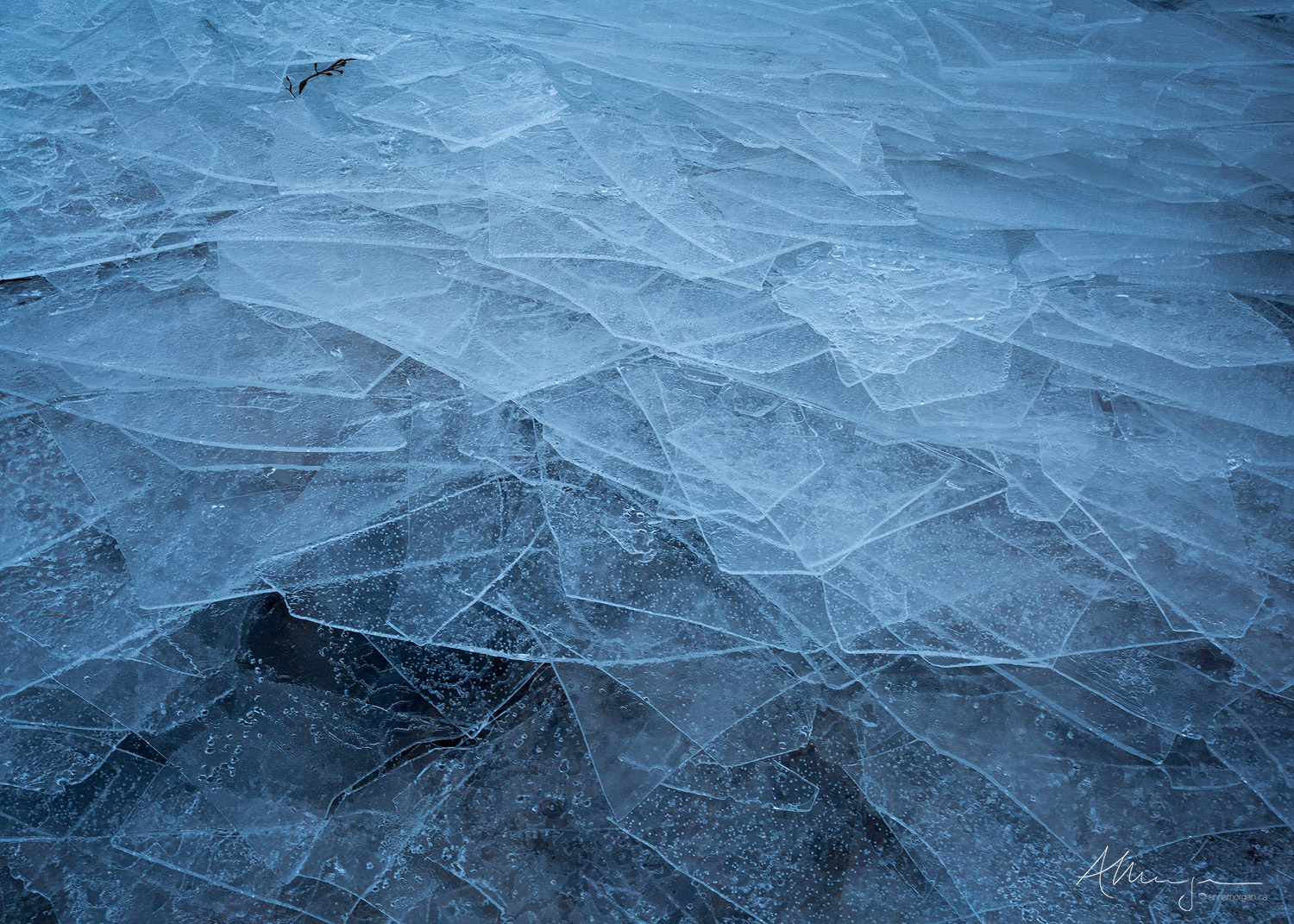 Layers of frozen ice washed up on  shore