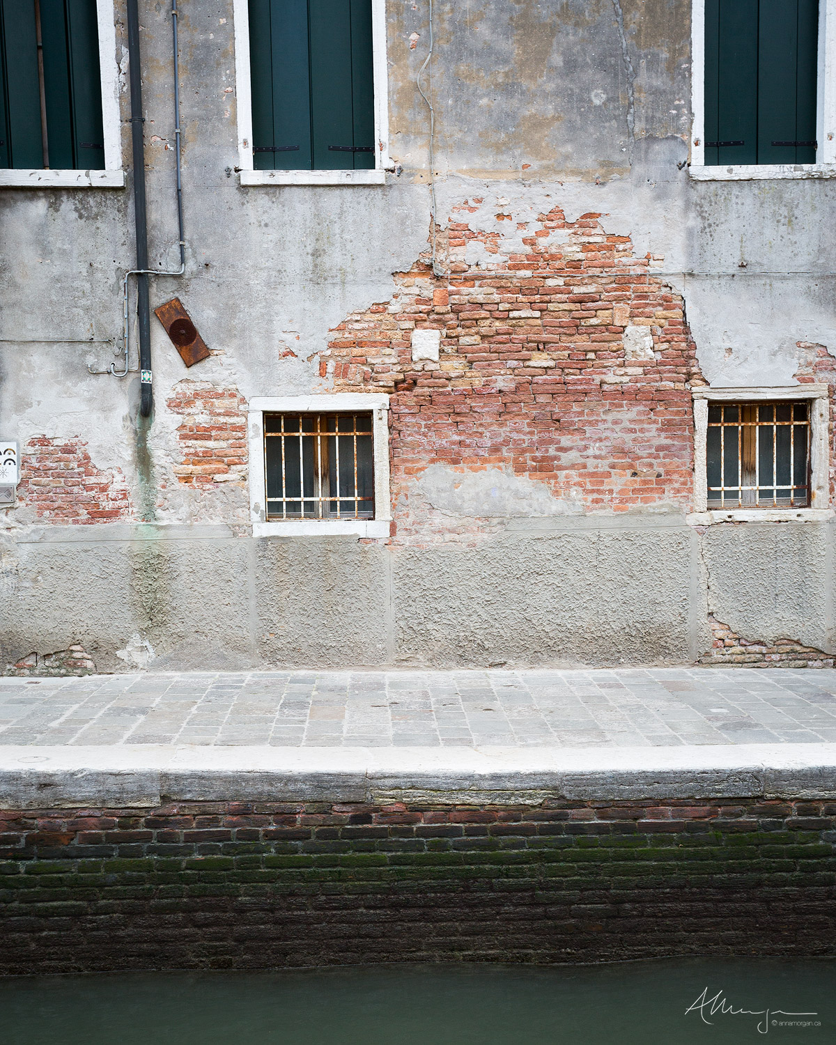 The crumbling exterior of a Venetian building 